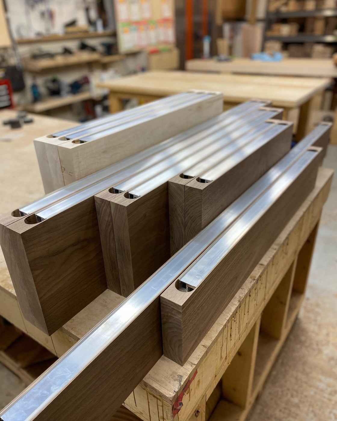 Aluminum bracket channel routed into a wood shelf